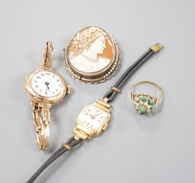 A lady's early 20th century 9ct gold manual wind wrist watch, on a 9ct strap, gross 16.4 grams, a lady's 18k watch, gross 9.9 grams, a cameo brooch and a 9ct dress ring.
